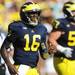 Michigan senior quarterback Denard Robinson makes his way to the sidelines after scoring a touhdown in the second quarter at Michigan Stadium on Saturday. Melanie Maxwell I AnnArbor.com
